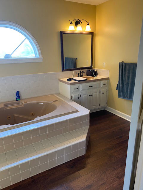 Warm Transitional Primary Bathroom Pewaukee Wisconsin Before