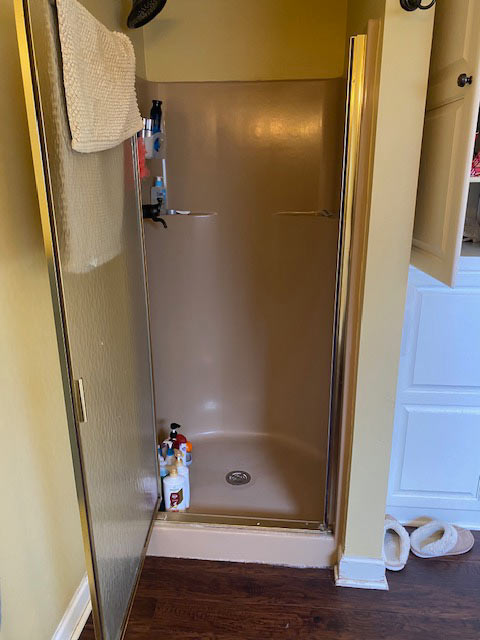 Warm Transitional Primary Bathroom Pewaukee Wisconsin Before